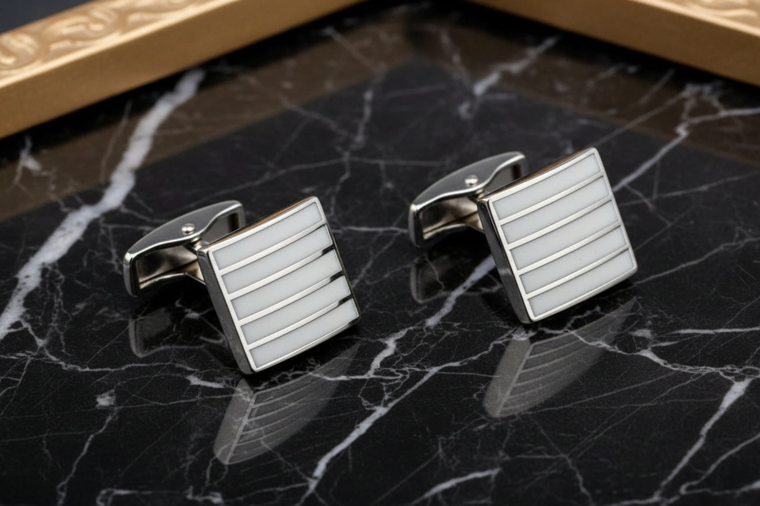 A Chrome, Pearl Lined Shaped Cuff-links
