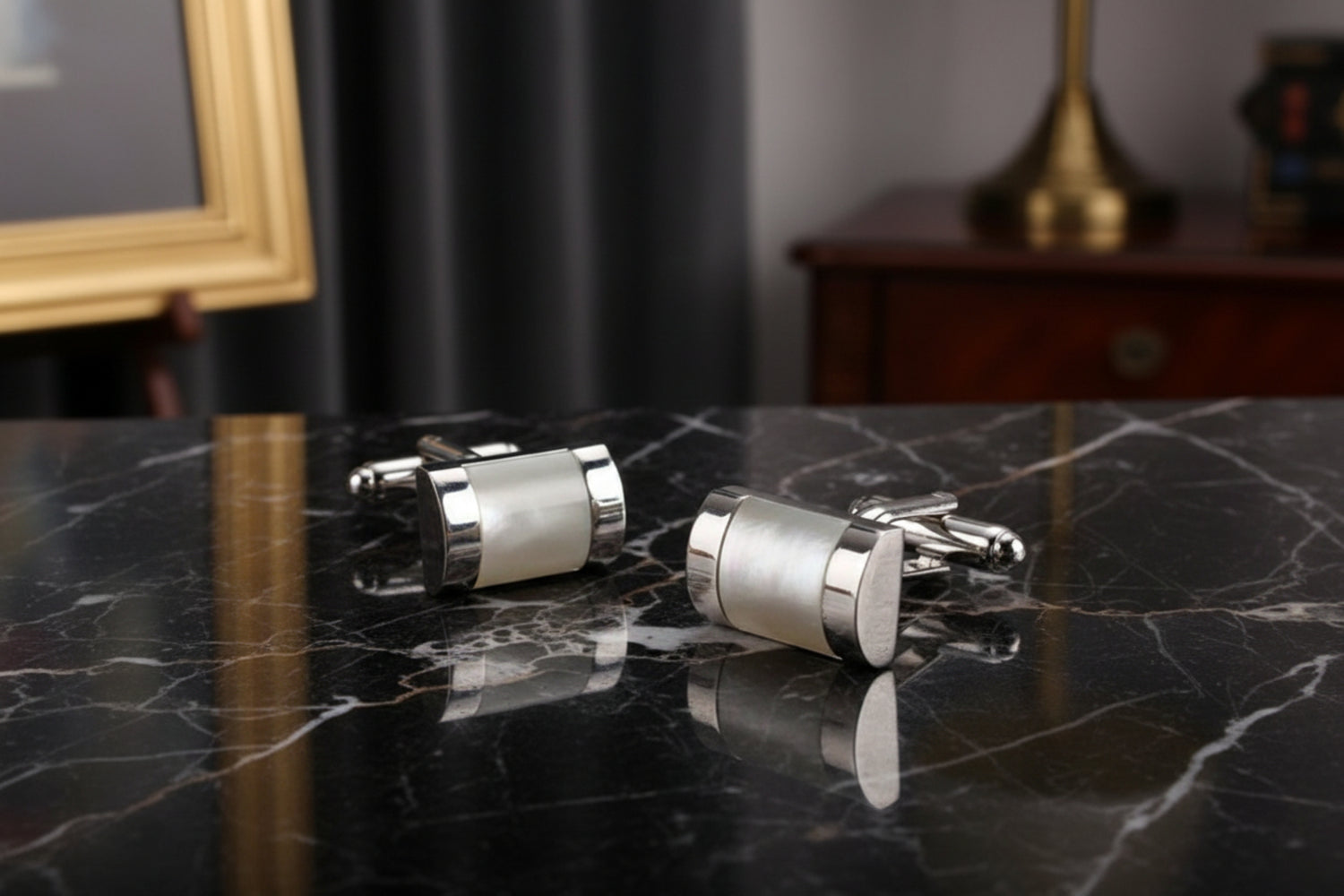 A Chrome and Pearl Colored Sphere Shaped Cuff-links
