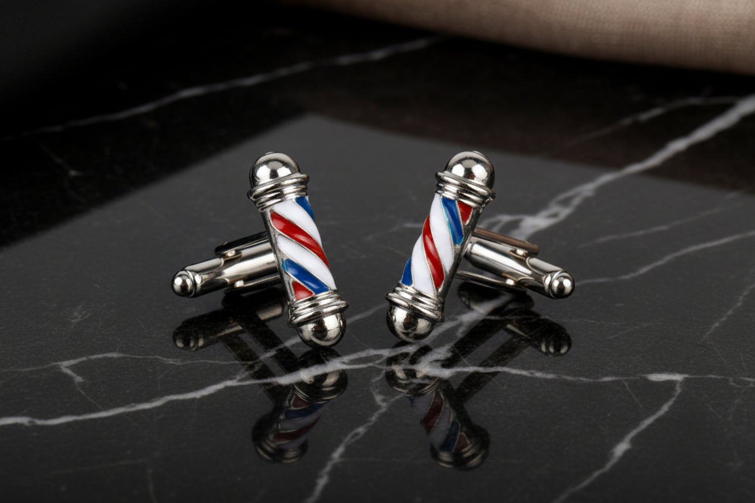 A Chrome, Red, White, Blue Barber Pole Shape Cuff-links||Silver