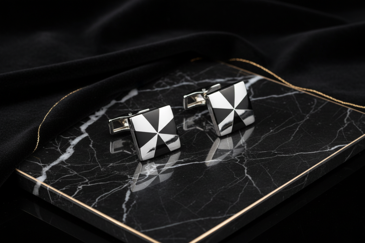 A Chrome and Black X Design Cuff-links