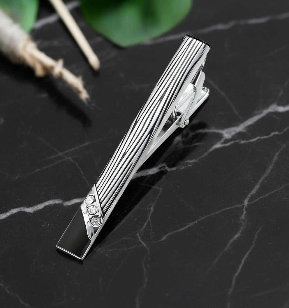 A Black, Chrome Rectangle Shape with Zebra Pattern and Stone Tie Bar